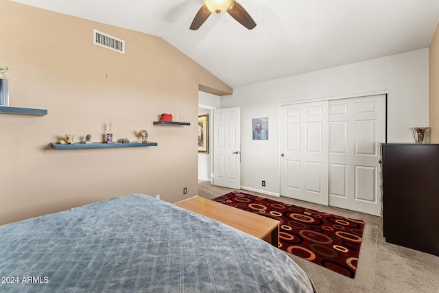 bedroom featuring carpet flooring, ceiling fan, a closet, and lofted ceiling