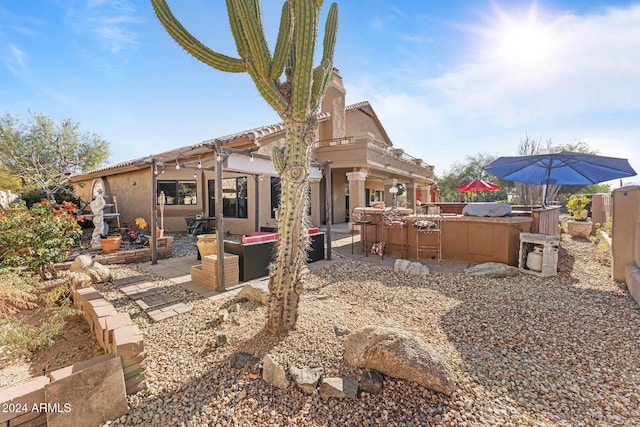 rear view of property with a patio area and area for grilling