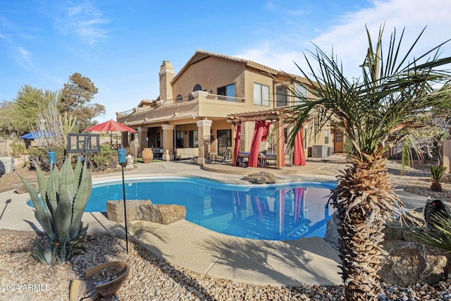 view of swimming pool featuring a patio area