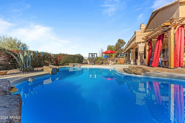 view of pool featuring a patio area