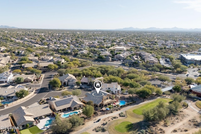 birds eye view of property featuring a mountain view