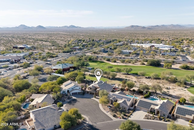 birds eye view of property with a mountain view