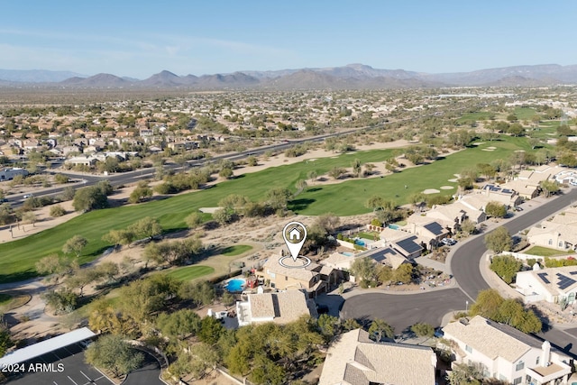 birds eye view of property with a mountain view