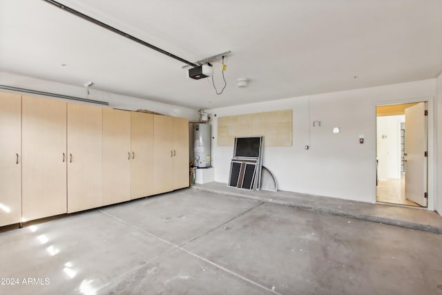 garage with water heater and a garage door opener