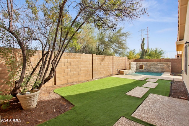 view of yard with a fenced backyard