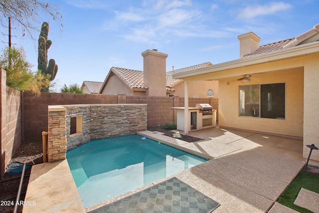 view of pool with area for grilling, a grill, a fenced backyard, and a patio area