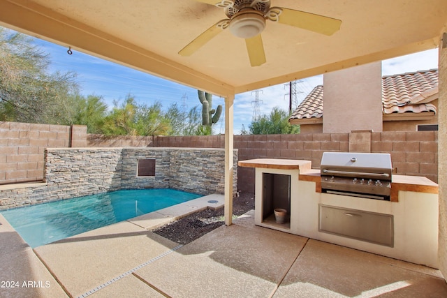 view of pool featuring area for grilling, a patio, a fenced backyard, exterior kitchen, and ceiling fan