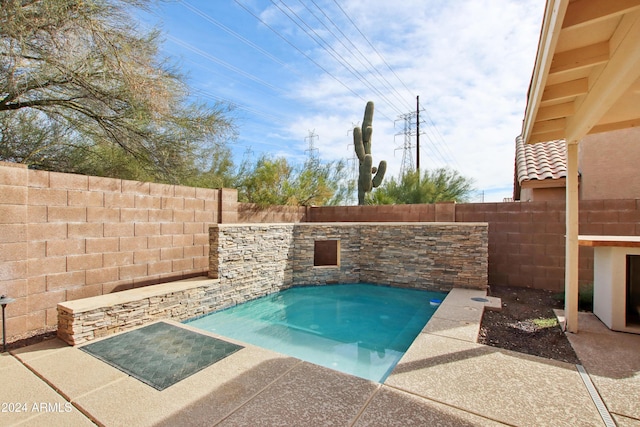 view of swimming pool featuring a fenced backyard