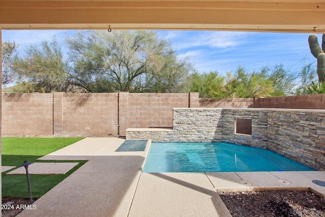 view of swimming pool featuring a fenced in pool, a patio, and a fenced backyard