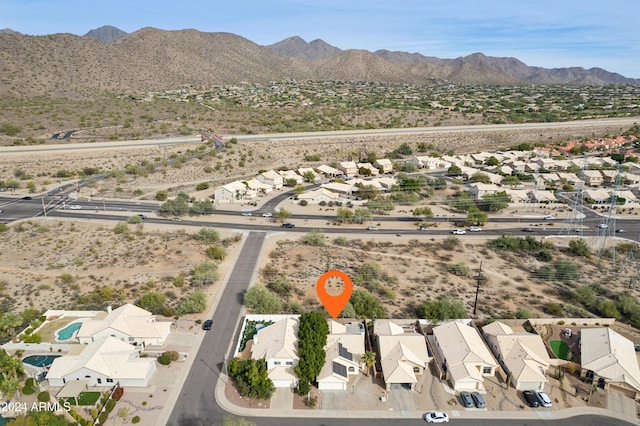 drone / aerial view featuring a residential view and a mountain view