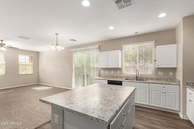 3713 S 54th Ln, Phoenix, AZ 85043 - kitchen featuring a sink, black dishwasher, white cabinetry, a chandelier, and a kitchen island