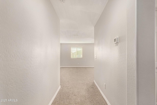 3713 S 54th Ln, Phoenix, AZ 85043 - corridor with carpet flooring, baseboards, and a textured wall
