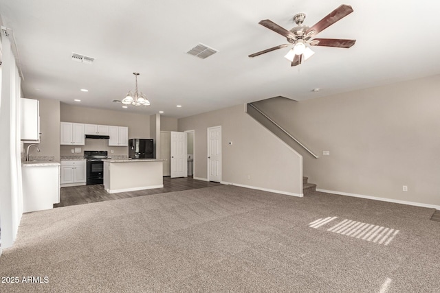 3713 S 54th Ln, Phoenix, AZ 85043 - unfurnished living room with dark carpet, baseboards, recessed lighting, ceiling fan, and stairs