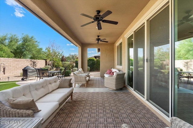 view of patio / terrace with ceiling fan, fence, and an outdoor hangout area