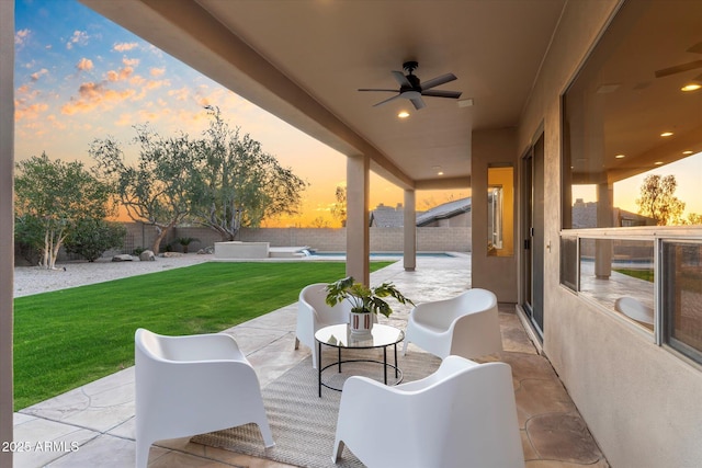 view of patio with a fenced backyard, ceiling fan, a fenced in pool, and an outdoor living space