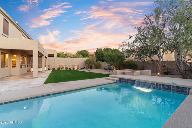 view of pool with a yard, a patio, a fenced backyard, and a fenced in pool