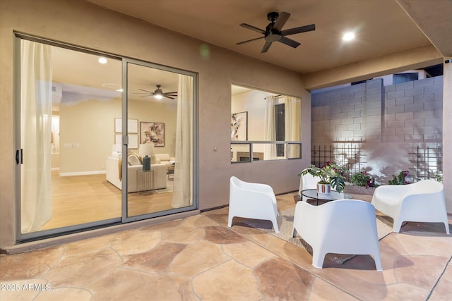 view of patio / terrace with outdoor dining area and a ceiling fan