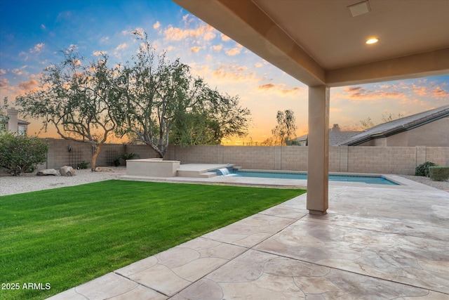 view of yard with a fenced in pool, a fenced backyard, and a patio