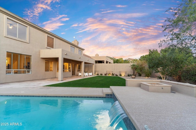 pool at dusk featuring a fenced in pool, a patio area, a yard, and fence