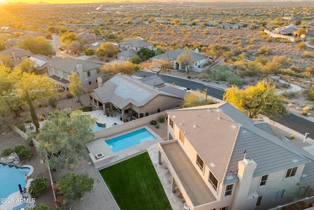 birds eye view of property with a residential view