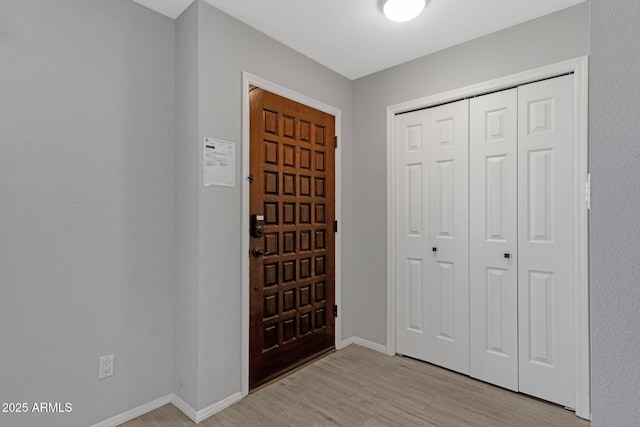 4918 N 74th St, Scottsdale, AZ 85251 - foyer with baseboards and light wood-style flooring