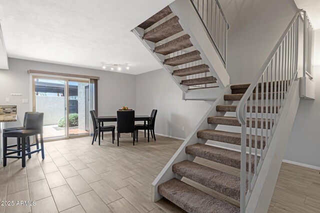 4918 N 74th St, Scottsdale, AZ 85251 - dining room with stairway and light wood-type flooring
