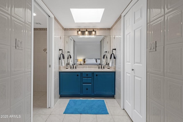 4918 N 74th St, Scottsdale, AZ 85251 - full bath with a closet, a skylight, tile patterned flooring, and double vanity