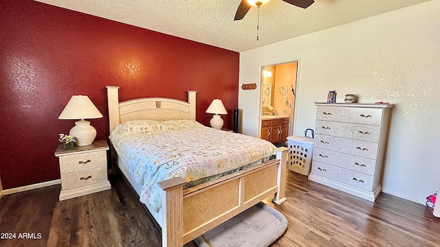 bedroom featuring ceiling fan, a textured ceiling, connected bathroom, and dark hardwood / wood-style flooring