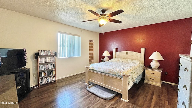 bedroom featuring dark hardwood / wood-style floors, a textured ceiling, and ceiling fan