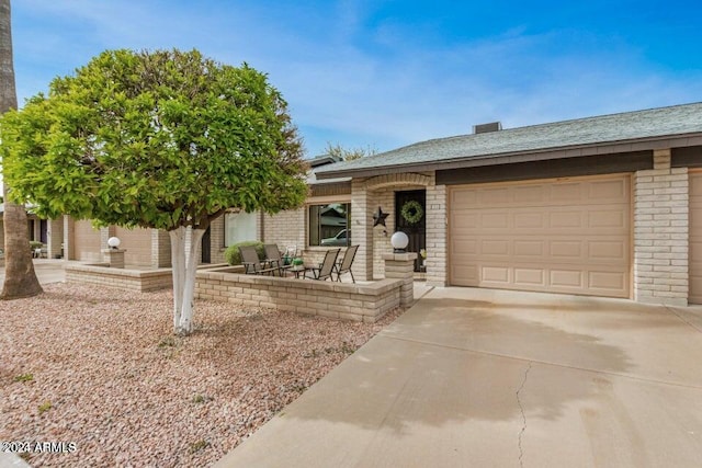 ranch-style home featuring a garage