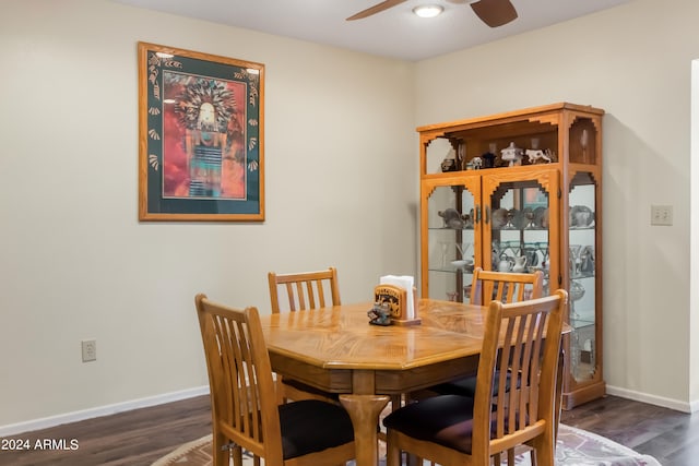 dining area with dark hardwood / wood-style flooring and ceiling fan