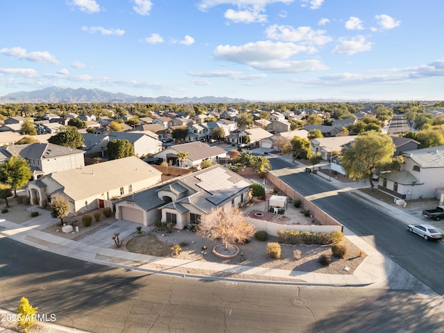 birds eye view of property with a mountain view