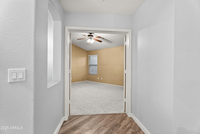 hallway with light wood-type flooring