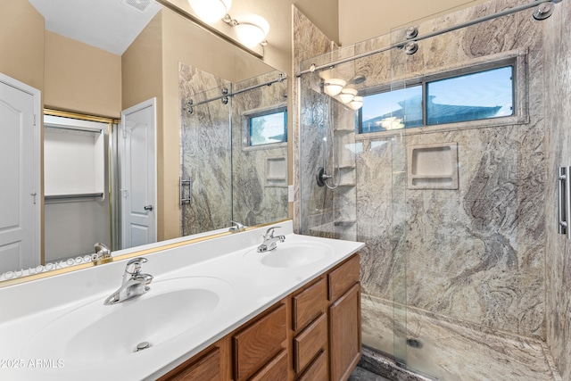 bathroom with vanity and an enclosed shower