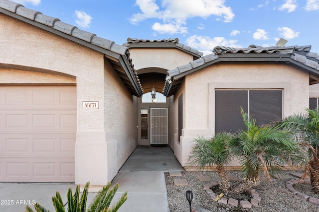 property entrance with a garage