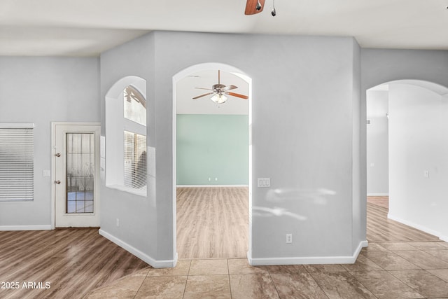 foyer entrance featuring ceiling fan and light tile patterned floors