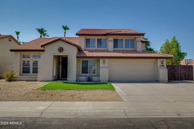 mediterranean / spanish-style house featuring a garage