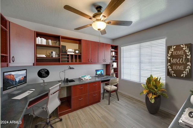 office with ceiling fan, a textured ceiling, and light wood-type flooring