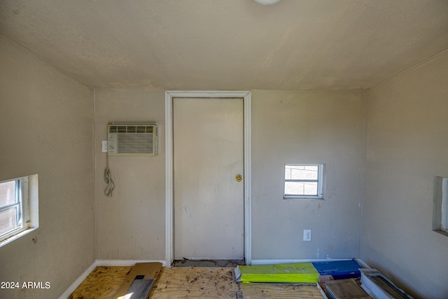 entrance to property featuring a wall unit AC