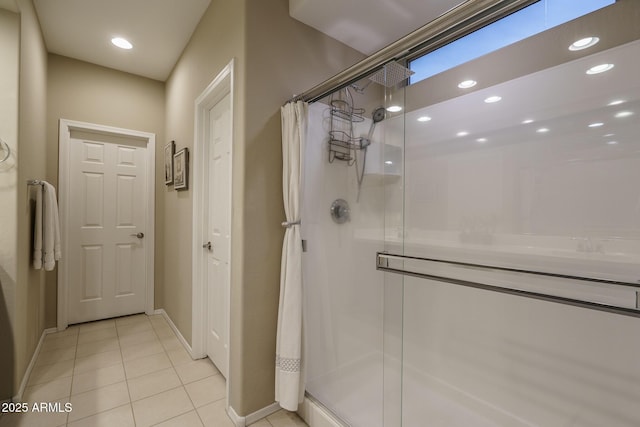 bathroom with tile patterned floors, recessed lighting, a shower stall, and baseboards