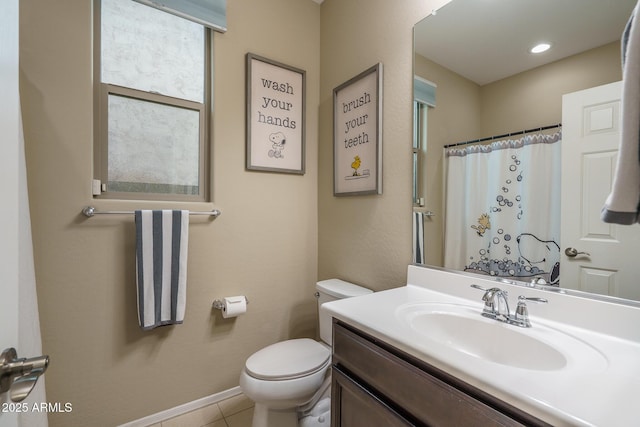 bathroom featuring vanity, a shower with shower curtain, baseboards, tile patterned floors, and toilet