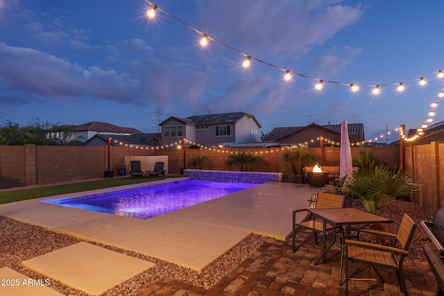 view of swimming pool with a patio, a fenced backyard, and a fenced in pool