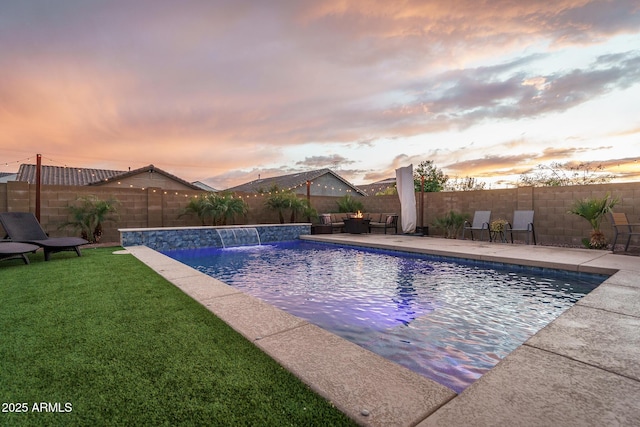 view of swimming pool featuring a fenced in pool, a lawn, outdoor lounge area, a fenced backyard, and a patio