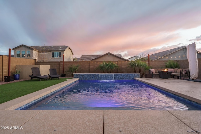 pool at dusk featuring a patio area, a fenced in pool, an outdoor hangout area, and a fenced backyard