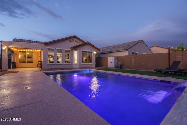 view of pool featuring a patio area, a fenced in pool, and fence