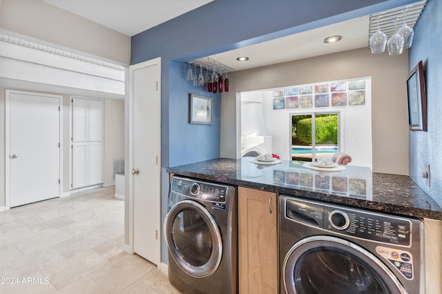 laundry room featuring washer and clothes dryer