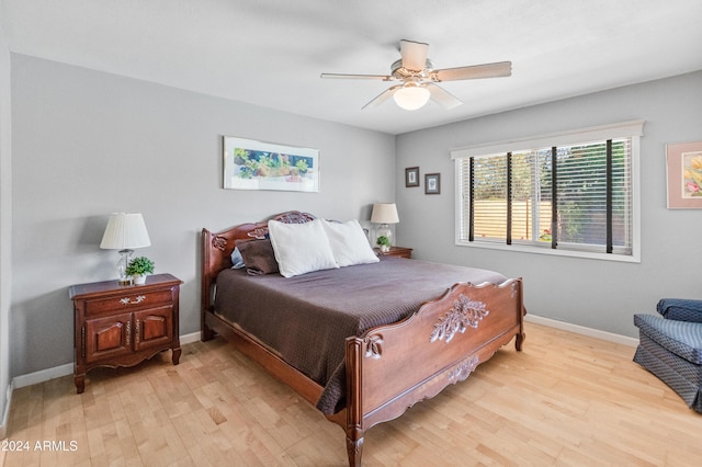 bedroom with light hardwood / wood-style floors and ceiling fan