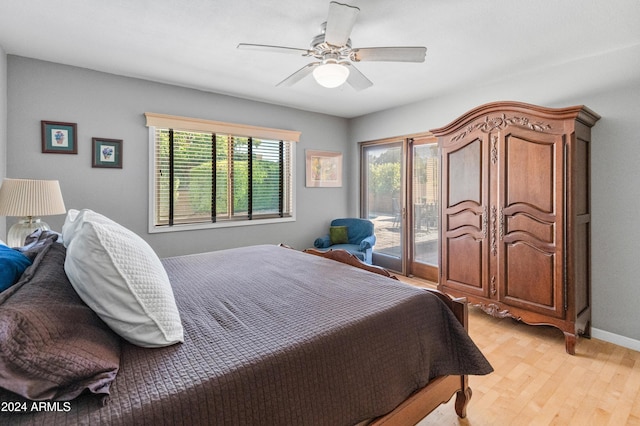 bedroom featuring access to exterior, ceiling fan, and light hardwood / wood-style flooring