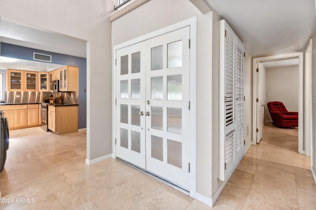 hallway featuring french doors