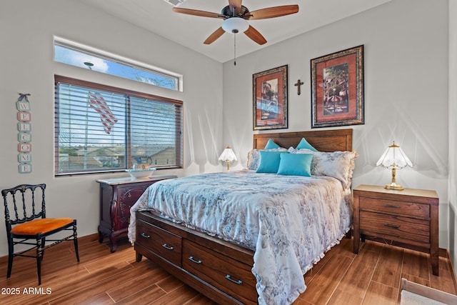 bedroom with baseboards and wood tiled floor